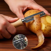 Stainless steel vegetable peeler with wooden handle