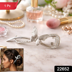 Metal butterfly hair pin on white background