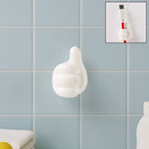 White hand-shaped wall clip with thumb grip