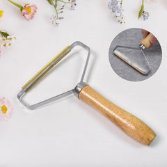 Lint remover showing copper scraper side