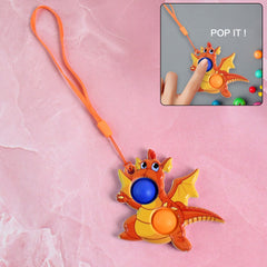Dragon-shaped push pop fidget toy with orange strap