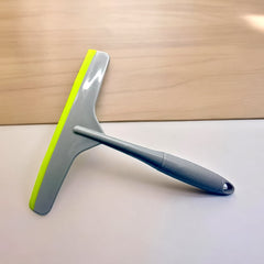 Plastic kitchen wiper with silicone head on white background