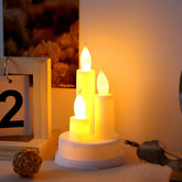 A pair of realistic LED taper candles flickering with warm white light, perfect for home decor.