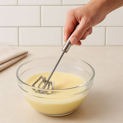 Close up of stainless steel hand blender whisk