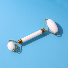 Dual-ended face massage roller with cooling stone on metal frame