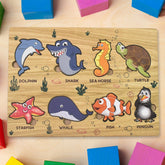 Wooden Sea Animal Puzzle Board with vibrant colored shapes