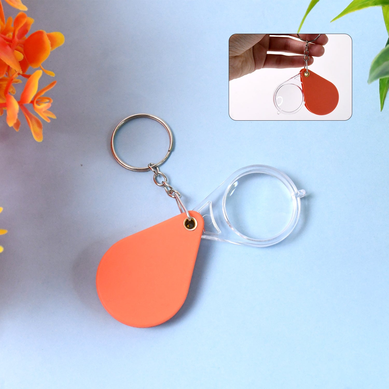 Portable folding magnifier keychain in orange color