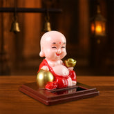 Solar powered moving head Buddha statue car ornament in mixed colors