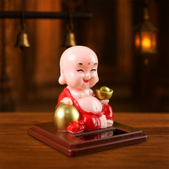 Solar powered moving head Buddha statue car ornament in mixed colors