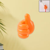 Orange hand-shaped wall clip hanger holding cables