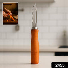 Close up of stainless steel vegetable peeler with wooden handle