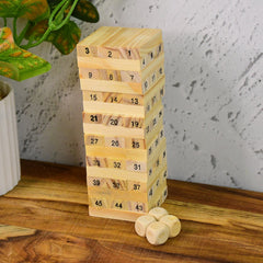 A tall tower of natural wooden blocks with dice, ready for a challenging Wooden Stacking Game.