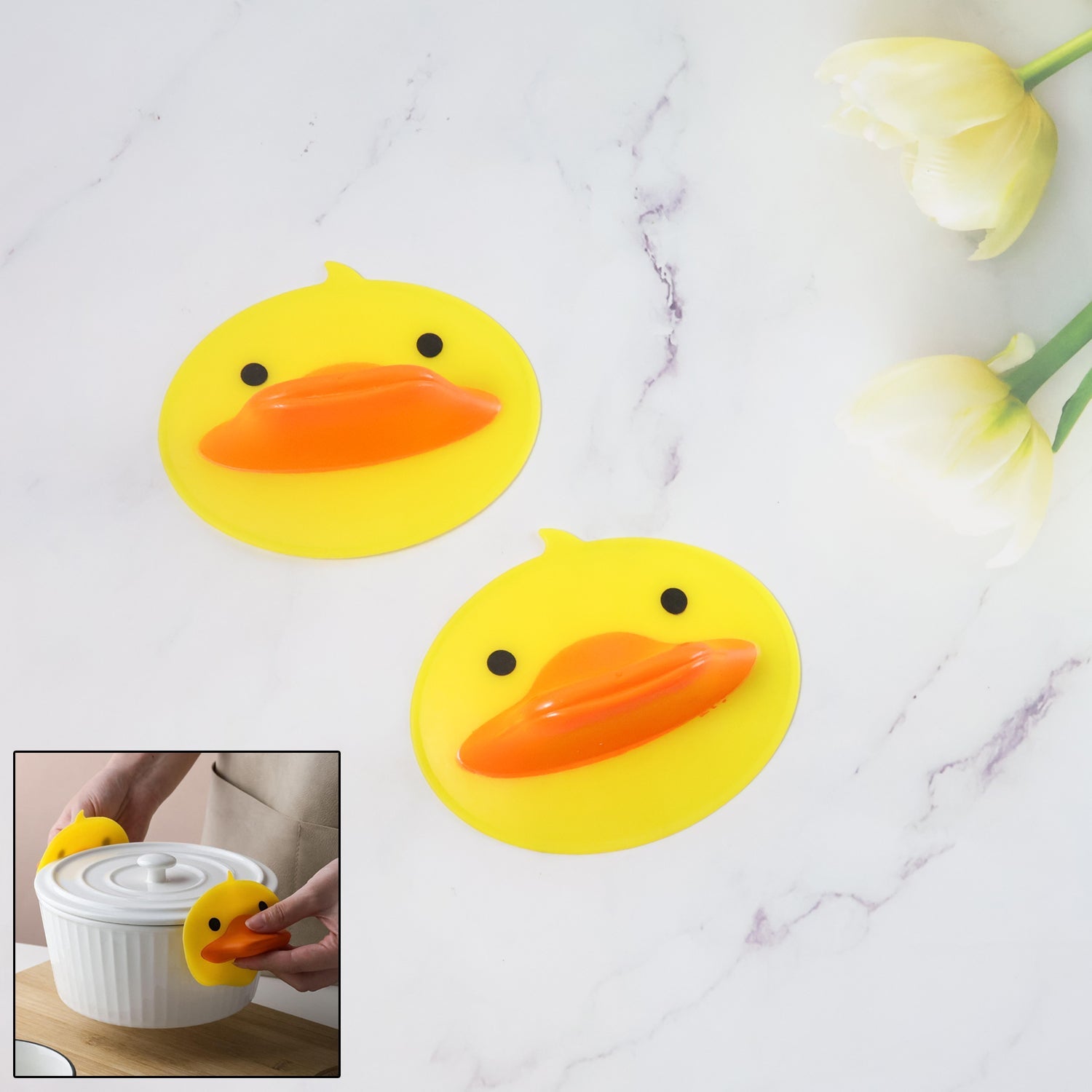 Duck Shape Silicone Hot Pot Holder lifting a pot lid