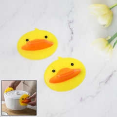 Duck Shape Silicone Hot Pot Holder lifting a pot lid