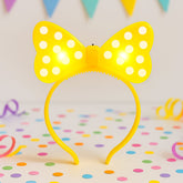 LED glowing polka dot bow hairband shown front view