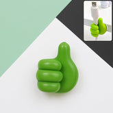 Green hand-shaped wall clip holder with thumb grip