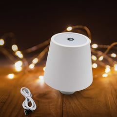 Close-up of touch control button on LED bottle lamp