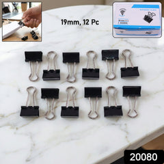 Black metal binder clips set on white background