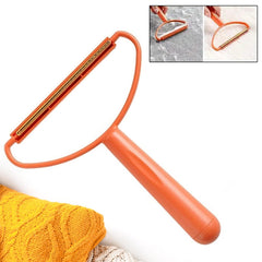 Lint remover smoothing brush side on fabric