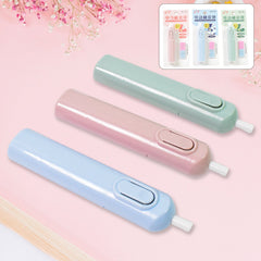 Hand holding electric eraser, in use