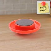 Red circular magnetic board button on whiteboard
