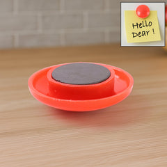 Red circular magnetic board button on whiteboard