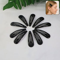 Close-up of matte metal hair clip snapping open