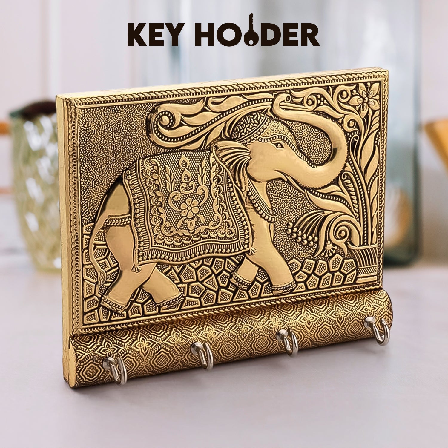 Stylish wooden key holder with gold elephant design