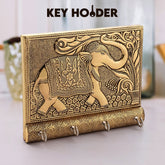 Stylish wooden key holder with gold elephant design