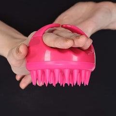 Scalp Massager Comb held in hand