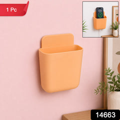 Close-up of Plastic Storage Pocket mounted on wall with keys and phone