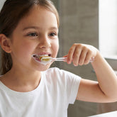 Manual toothbrush with protective travel case in use