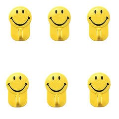 Plastic self-adhesive smiley face hooks on surface