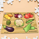 Wooden vegetable puzzle board showing colorful vegetable shapes