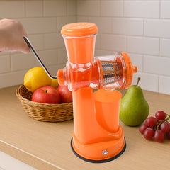 Manual juicer clamped on a surface extracting juice