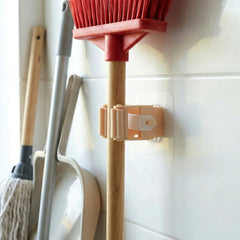 Stick holder clip mounted on wall