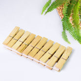 Heavy duty bamboo wooden cloth clips on white background
