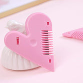 Pink heart shape plastic hair cutting scissors with open blades