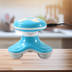 Triangle mini massager vibrating on arm muscle