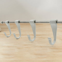 Side view of stainless steel kitchen utensil hanger with hooks