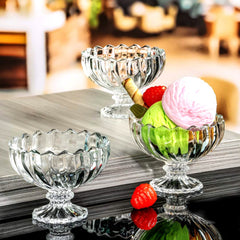 Clear glass parfait cups with layered fruits and dessert