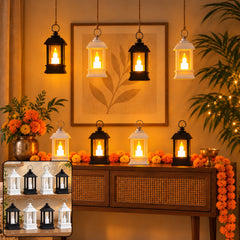 Eight small black and white lanterns with glowing LED candles are arranged on a wooden console table and hanging – view 3