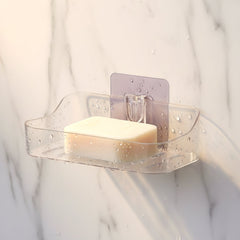 Two clear plastic soap holders side by side