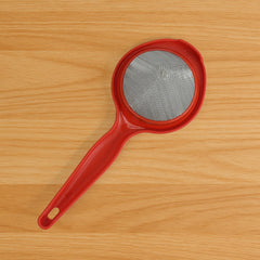 Stainless steel mesh tea strainer with mint leaves