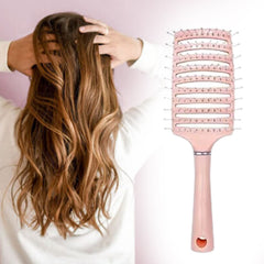Calm Tress massage comb on wooden surface