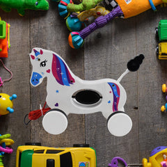 Rear view of the unicorn pull toy with its pull string