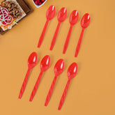 Set of 8 reusable plastic spoons arranged neatly