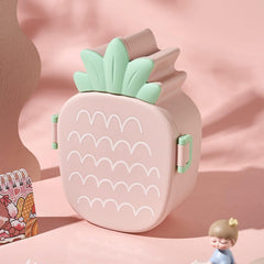 Open pineapple lunch box showing food compartments