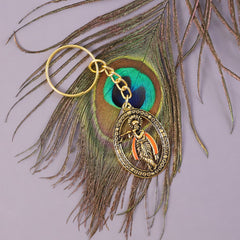 Lord Krishna keychain in hand showing size