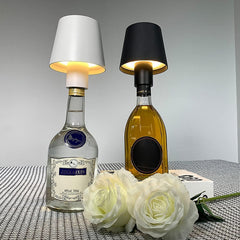 LED bottle lamp illuminating different colored wine bottles